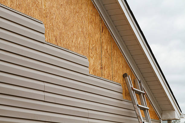 Professional Siding Replacement technician working in Hempstead, NY
